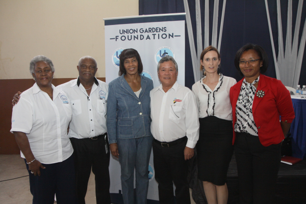 Members of the Union Garden Foundation pose for a photo with Prime Minister, the Most Hon. Portia Simpson-Miller.   Shown, from left, are Marva Christian, Glen Christian, Gary ‘Butch’ Hendrickson, Melanie Subratie, and Simone Murdock.