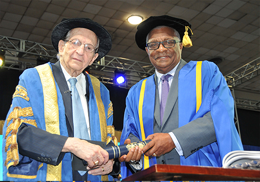 CEO and Chairman, Dr. the Hon. Glen Christian, OJ being conferred with the  degree of Doctor of Laws, Honoris Causa by Chancellor of the University of Technology, the Most Hon. Edward Seaga. The honorary degree was presented on Thursday, November 3 during the Presentation of Graduates ceremony held at the National Arena. 