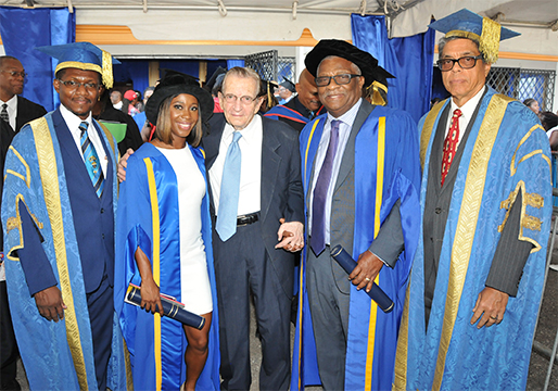 Dr. the Honourable Glen Christian and fellow awardee, Ambassador Shelly Ann Fraser Pryce pictured with University of Technology Chancellor, Most Hon. Edward Seaga. Sharing the moment are, Acting President Professor Colin Gyles (at left) and Pro Chancellor Richard Powell. Dr. Christian was conferred with the  degree of Doctor of Laws, Honoris Causa.